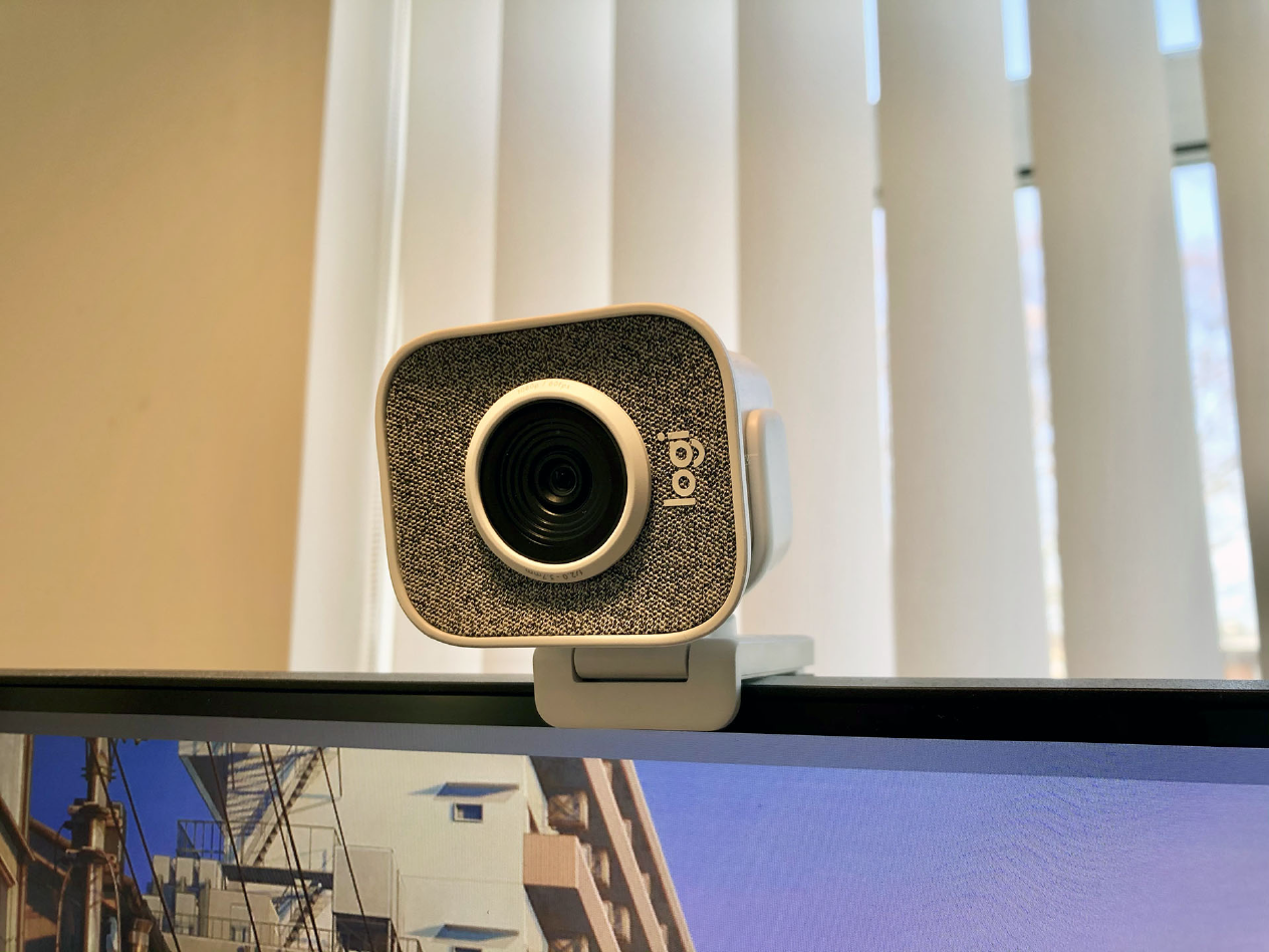 My Logitech StreamCam in white, mounted on top of my monitor.